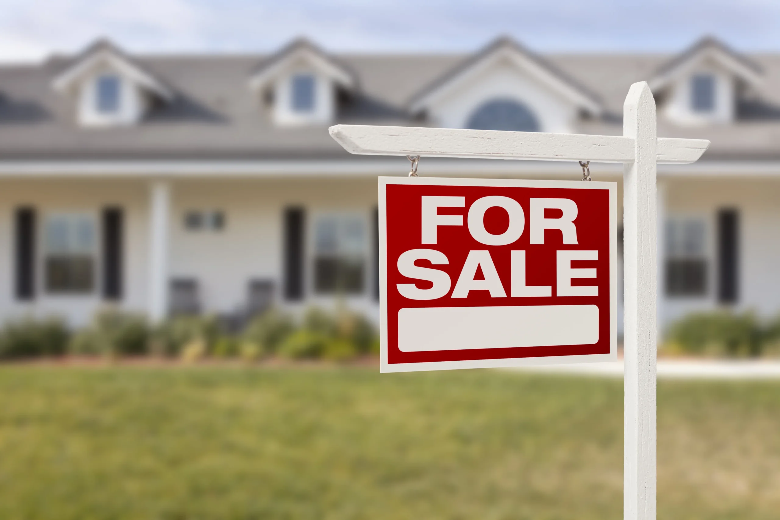 For Sale Real Estate Sign in Front of Beautiful New Home
