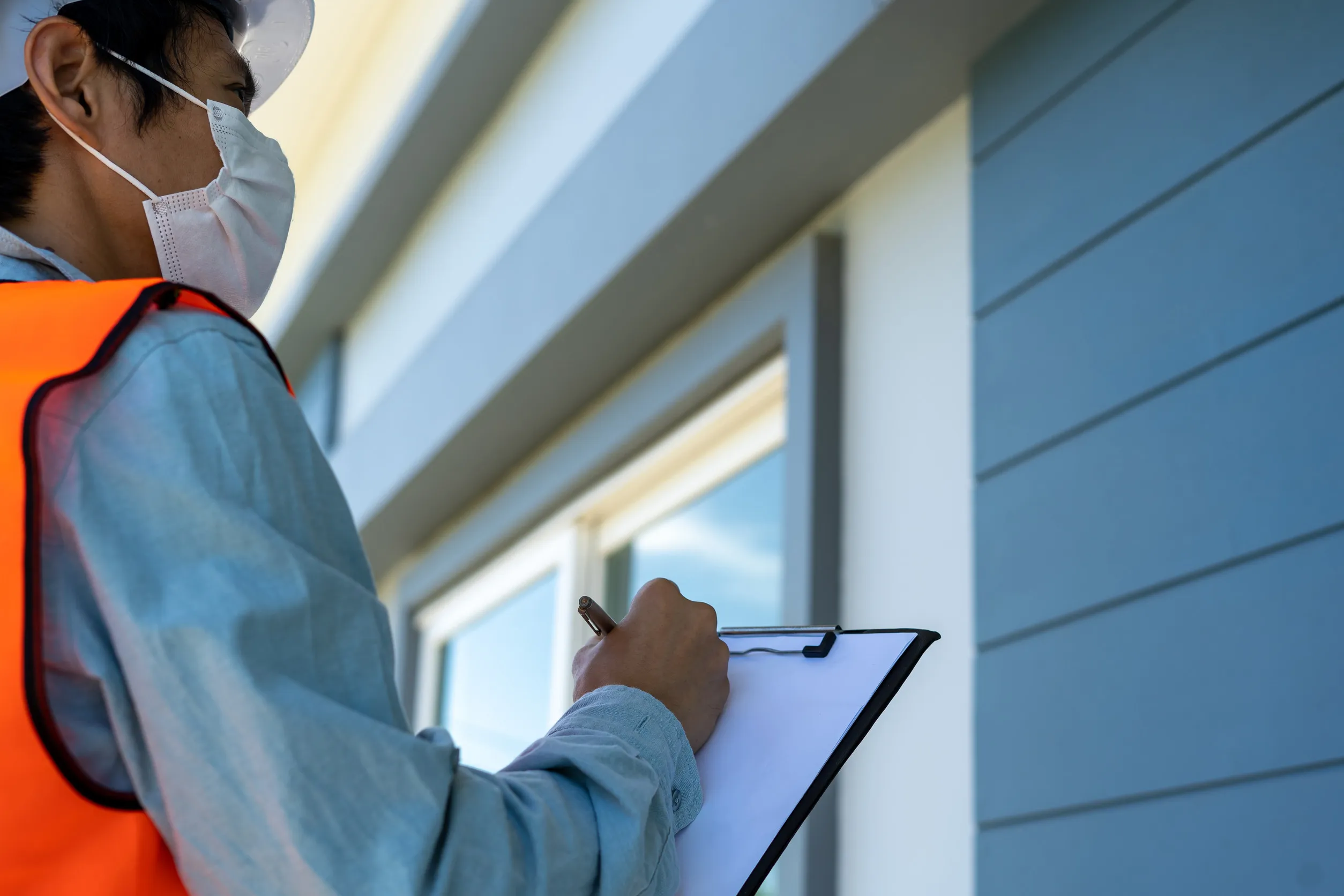 Inspector is checking and inspecting the building or house by using checklist